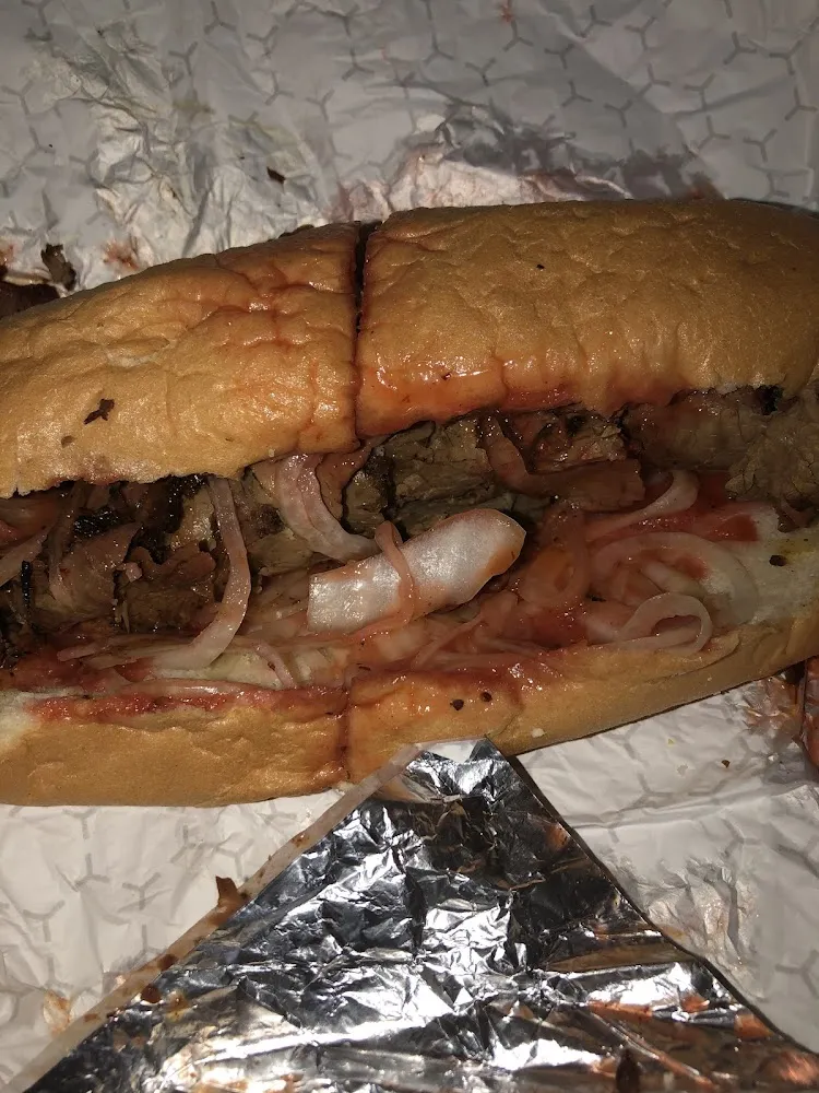 Pit Beef with Onions Hot Sauce and Barbecue Sauce